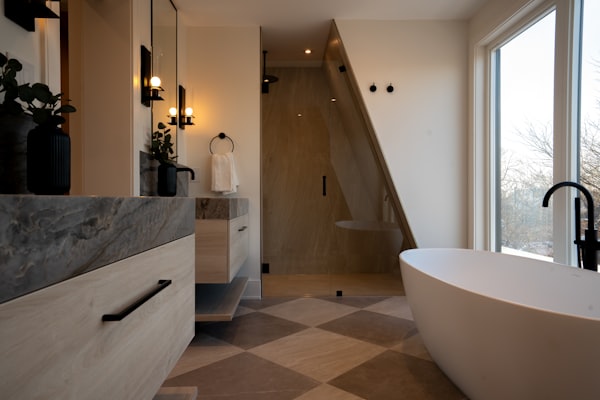 Modern luxury bathroom with freestanding tub and stone vanity